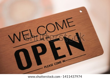 A sign hanging off Coffee shop door,Close sign blur background,Label word close