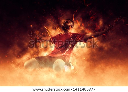 One soccer player man happy celebration winner on flames background – Image