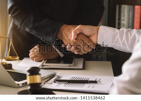 business people and lawyers discussing contract papers sitting at the table. Concepts of law, advice, legal services. in morning light
 Royalty-Free Stock Photo #1411538462