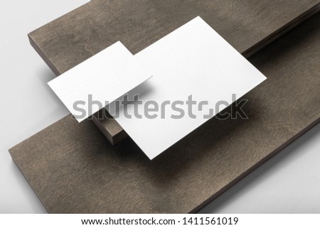 Real photo, stationery branding mockup template, isolated on light grey background with wooden elements to place your design.