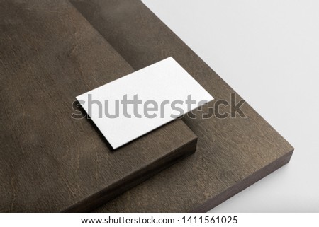 Real photo, stationery branding mockup template, isolated on light grey background with wooden elements to place your design.