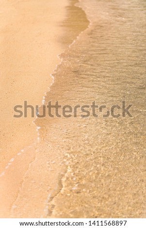 waves crashing on a sandy beach on an island of okinawa in Japan