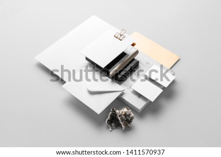 Real photo, stationery branding mockup template, isolated on light grey background, with marble and floral elements to place your design.