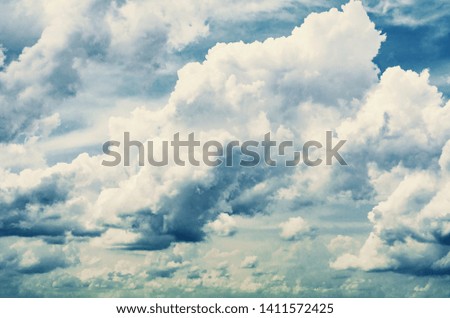 Just a photograph of white clouds in the blue sky