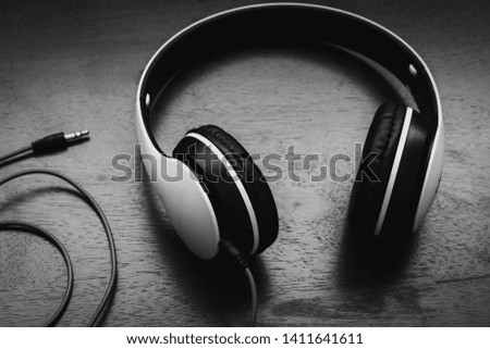 Black headphones on old wooden table ,Turkey - Middle East, Full Frame, Textured, Metal, Textured Effect 