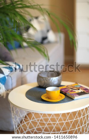 Modern room interior with table, chairs and pictures on the wall