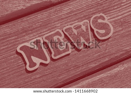 word news made of wooden letters on wood background