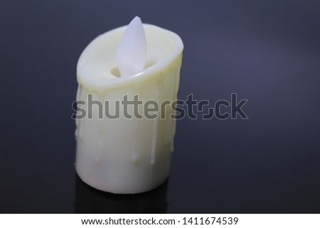An off white artificial candle photo on a nice background