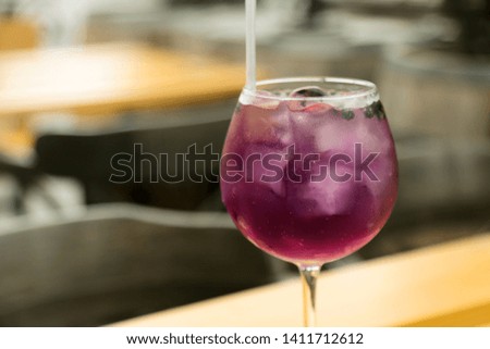 Purple refreshing gin cocktail, outdoors