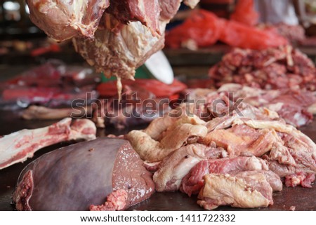 Beef liver and other meats at butchers counter 