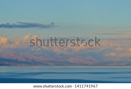 Seascape with sky at sunset with colorful clouds.