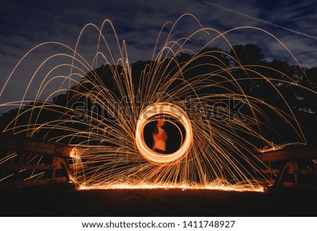 Spinning steel wool while a plane is passing giving a great result on the picture.