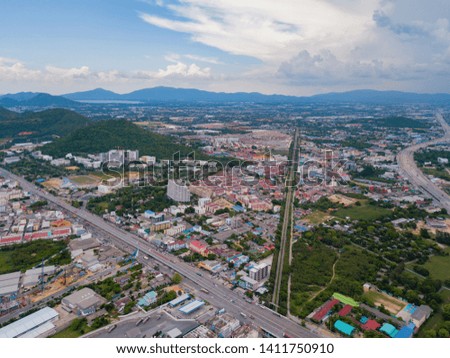 Aerial view of Pattaya town, Chonburi, Thailand. Tourism city in Asia. Hotels and residential buildings with blue sky at noon.