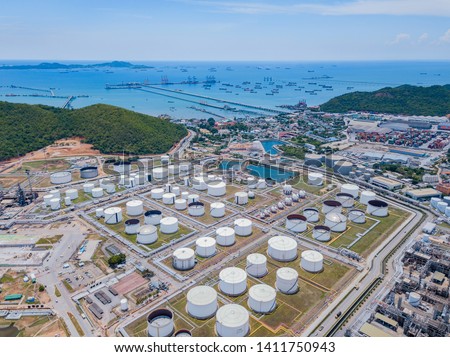 Aerial view of petrochemical oil refinery and sea in industrial engineering concept in Laem Chabang, Chonburi province, Thailand. Oil and gas tanks industry. Modern factory. Top view. Royalty-Free Stock Photo #1411750943