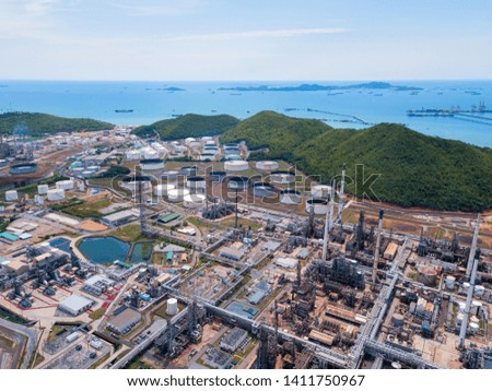 Aerial view of petrochemical oil refinery and sea in industrial engineering concept in Laem Chabang, Chonburi province, Thailand. Oil and gas tanks industry. Modern factory. Top view. Royalty-Free Stock Photo #1411750967