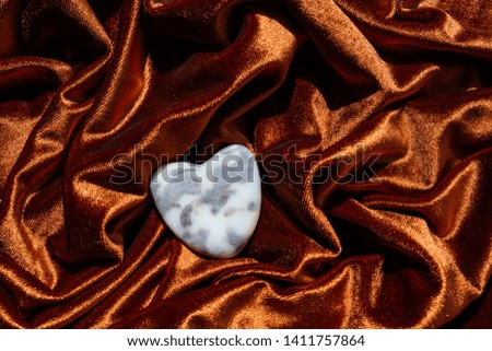 Heart on red gold fabric waves, valentine love concept