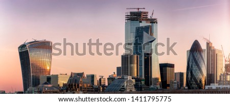 Panoramic view to the modern skyscrapers o the City of London during early morning sunrise, UK
