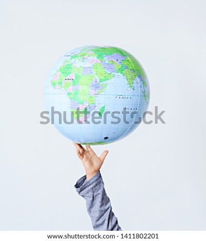hand with globe stock photo