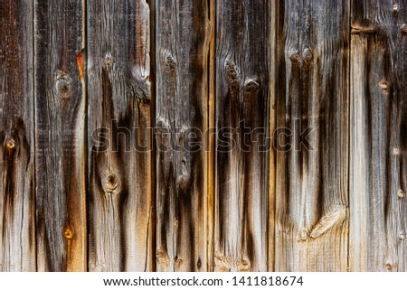 Worn aged plank fence background hanf dark half light
