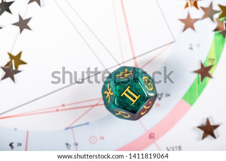 Astrology Dice with zodiac symbol of Gemini May 21 - Jun 20 on Natal Chart Background