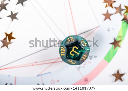 Astrology Dice with zodiac symbol of Aries Mar 21 - Apr 19 on Natal Chart Background