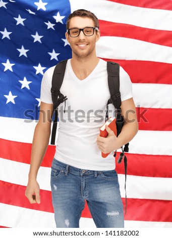 bright picture of travelling student with backpack and book over american flag