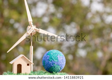 Future Alternative energy / Green Clean electric energy from renewable sources wind turbines for home and save earth. Idea on sustainable eco residential family house,use ecology renewable