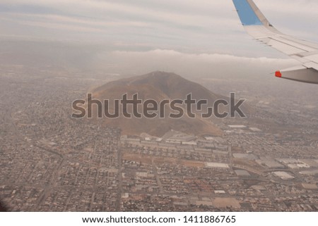 
Aerial shot over flying the grounds surrounding a mountain in the city of Tijuana Mexico