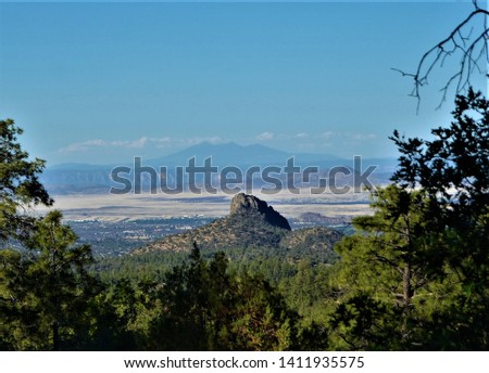 Thumb Butte is a distinctive landmark just west of Prescott, Arizona, and also a popular hiking destination. A picnic area at the base of the butte has several trailheads for exploring the area. Royalty-Free Stock Photo #1411935575
