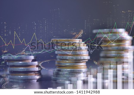 Financial investment concept, Double exposure of city night and stack of coins for finance investor, Forex trading candlestick chart economic , ECN Digital economy, best, technology, Industry, money. Royalty-Free Stock Photo #1411942988