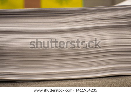 Stack of paper in a classroom