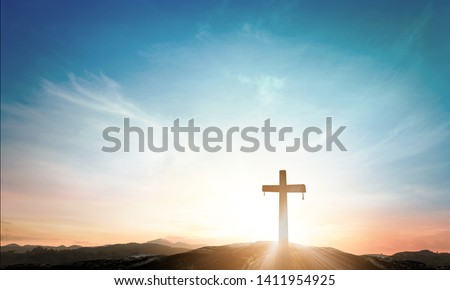 Easter Religious concept: The cross on mountain sunset background