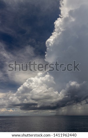 Rainclouds over the sea, vertical picture