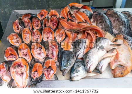 Parts of salmons for sale at a market