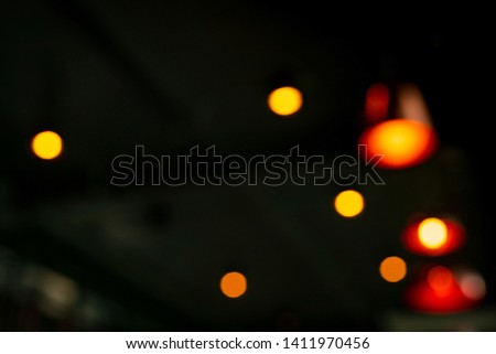 Blurred red, orange and yellow bokeh  abstract background. Blur bokeh on dark background. Street light effect with beautiful pattern. City light in the night. 