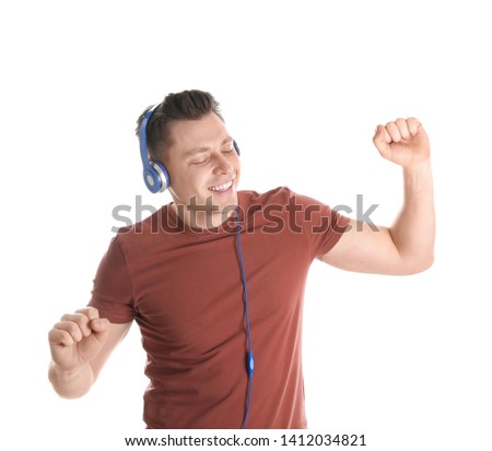 Man enjoying music in headphones on white background