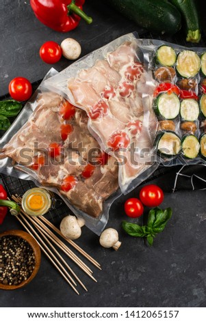raw for Grilled meat skewers on wooden board with vegetable salad– stock image