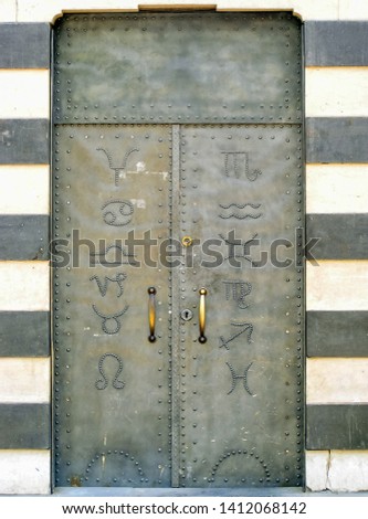 A decorated medieval metal door in the old center of Damascus, Syria.