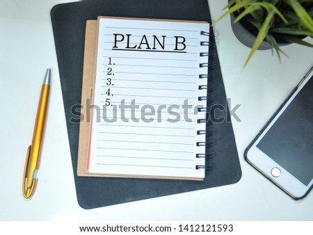 Planning concept. PLAN B word on notebook isolated on white background.