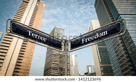 Street Sign the Direction Way to Freedom versus Terror