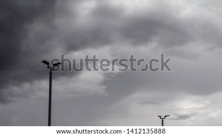 Dark gray dramatic sky with large clouds before rain.