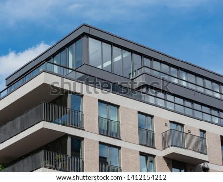 Building facade on the Harbor Street in Hamburg Lack of housing Royalty-Free Stock Photo #1412154212
