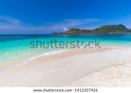 Tropical beach paradise and the blue sky at Khai Island in Satun Province , Thailand
