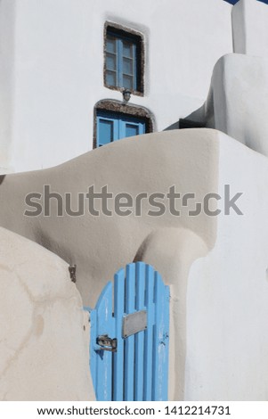 Mediterranean village with stone houses and small wooden wickets. Traditional greek architecture.