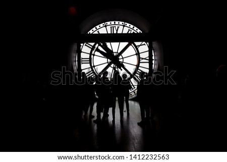 transparent white clock overlooking the city