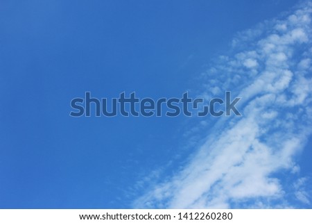 Blue sky with tiny clouds background on sunny day 