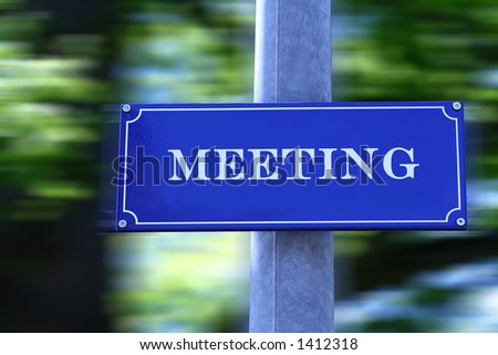 Street sign with text "Meeting".