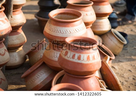 Earthen pot being made using potter's wheel, India 