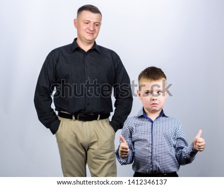 cool and serious. father and son in business suit. male fashion. happy child with father. business partner. family day. childhood. trust and values. fathers day. small boy with dad businessman.