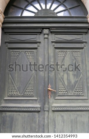 large massive antique doors of an old building